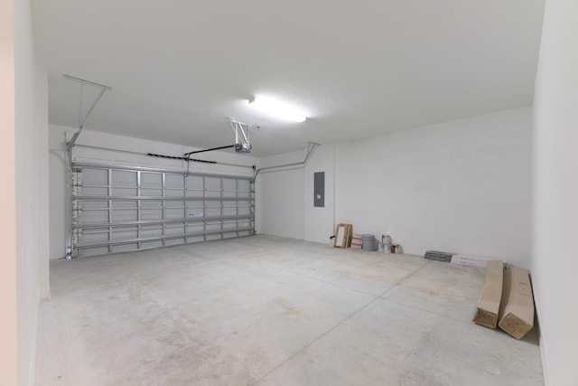 garage with a garage door opener and electric panel