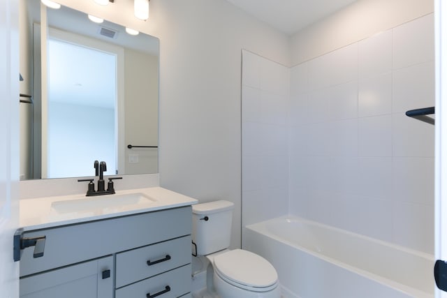 bathroom featuring toilet, washtub / shower combination, visible vents, and vanity