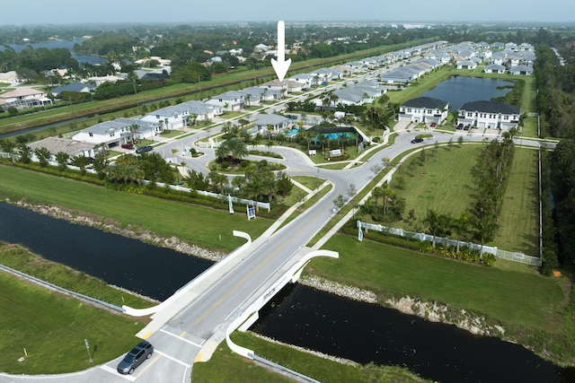 bird's eye view featuring a water view and a residential view