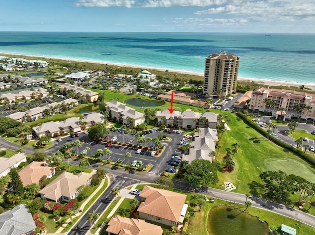 drone / aerial view with a residential view and a water view