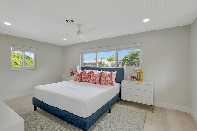 bedroom featuring recessed lighting, visible vents, light wood-style flooring, and baseboards