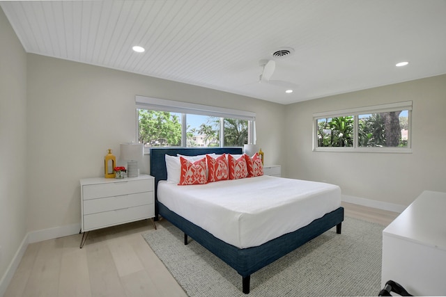 bedroom featuring recessed lighting, light wood-type flooring, and baseboards