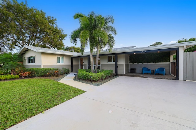 ranch-style house with a front yard