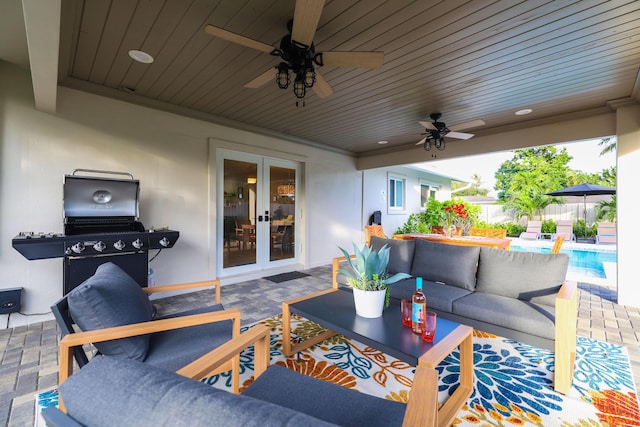 view of patio / terrace featuring a fenced in pool, french doors, fence, and an outdoor hangout area