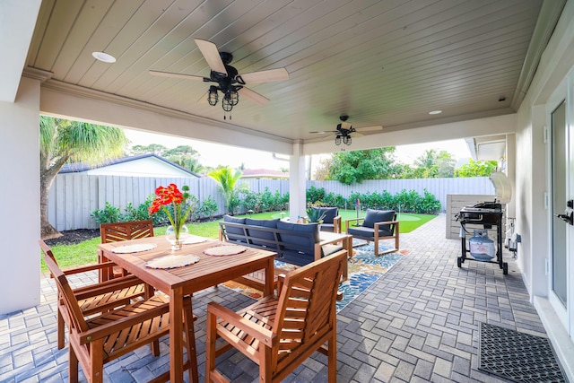 view of patio / terrace featuring ceiling fan, a fenced backyard, a grill, outdoor dining area, and outdoor lounge area