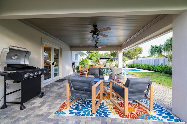 view of patio with a grill, fence, an outdoor living space, a ceiling fan, and french doors