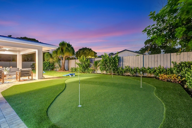 view of yard with a fenced backyard, a patio, and an outdoor hangout area