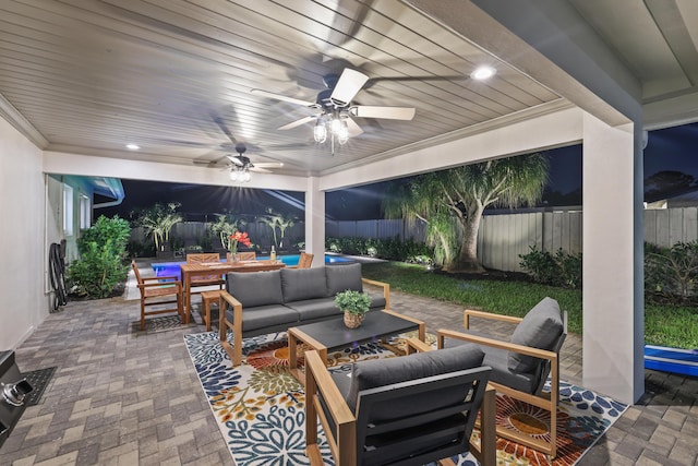 view of patio featuring an outdoor hangout area, outdoor dining space, a fenced backyard, and a ceiling fan