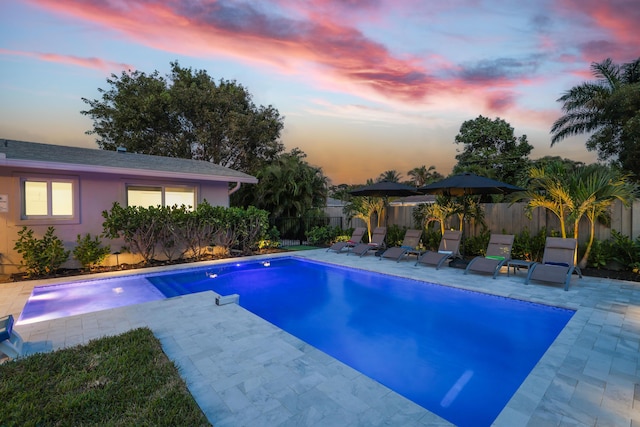 view of pool with a patio area, fence, and a fenced in pool