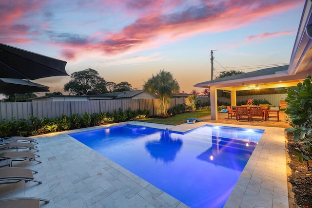 view of pool featuring a fenced in pool, a patio area, a fenced backyard, and an outdoor living space