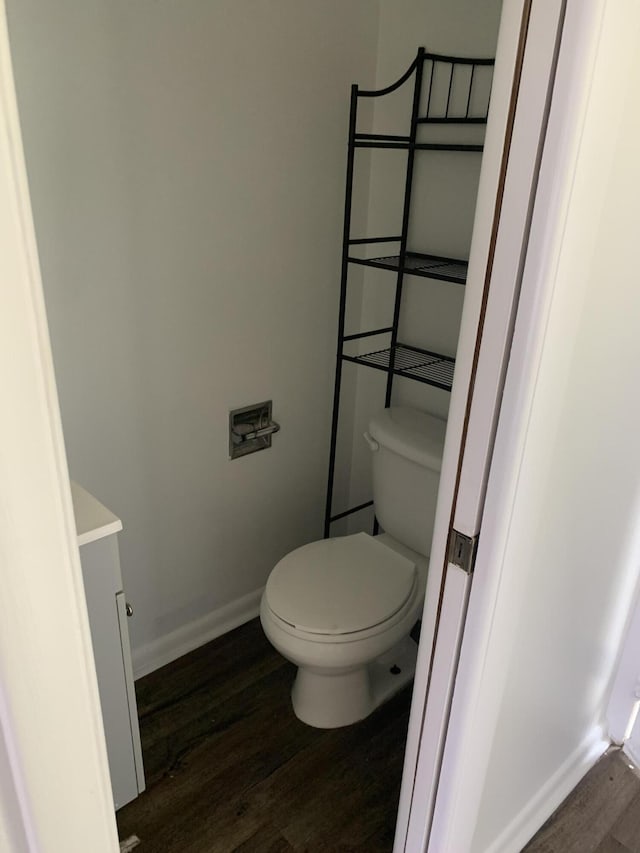 2820 Tennis Club Dr Unit 211, West Palm Beach, FL 33417 - bathroom with wood finished floors, toilet, and baseboards