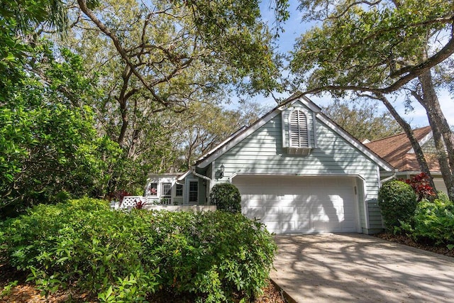 view of front facade featuring an attached garage and concrete driveway