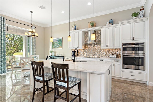 kitchen featuring double oven, a sink, visible vents, marble finish floor, and ornamental molding