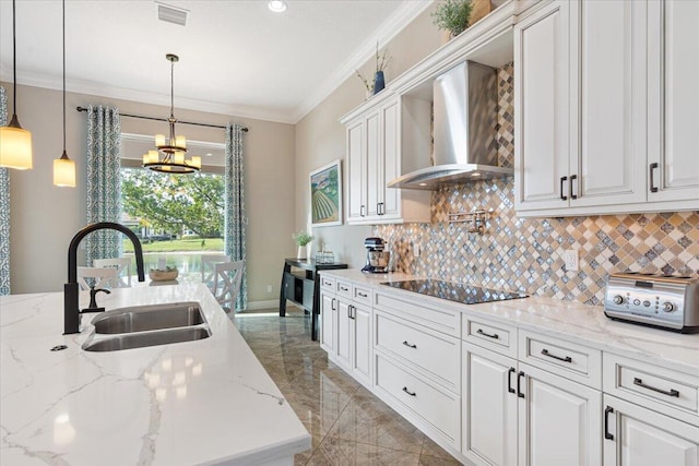 kitchen with black electric cooktop, a sink, visible vents, ornamental molding, and wall chimney range hood