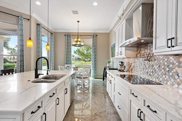 kitchen featuring crown molding, decorative backsplash, a sink, wall chimney range hood, and black electric cooktop