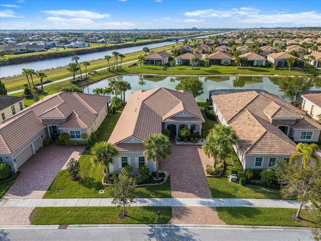 bird's eye view with a residential view and a water view