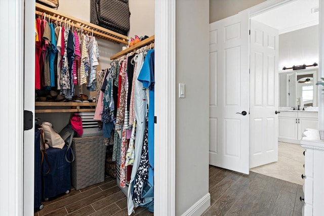 spacious closet featuring wood tiled floor