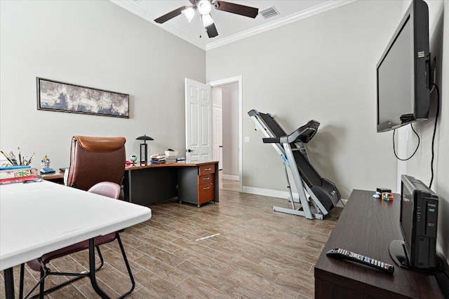 office area with ceiling fan, visible vents, baseboards, ornamental molding, and light wood finished floors