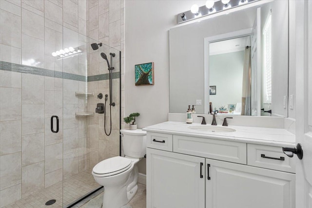 full bathroom featuring toilet, a stall shower, tile patterned flooring, and vanity