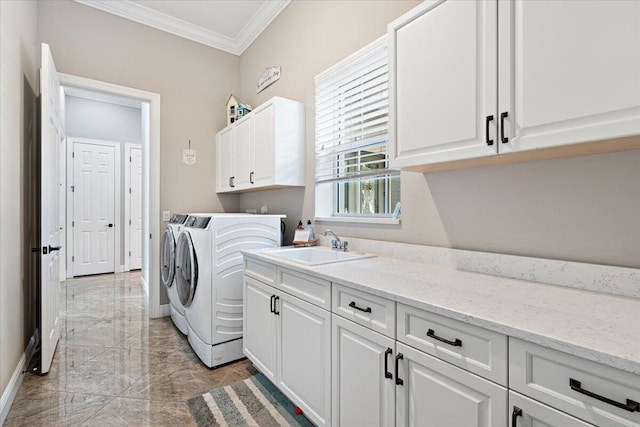 laundry area featuring a sink, marble finish floor, cabinet space, washer and clothes dryer, and crown molding