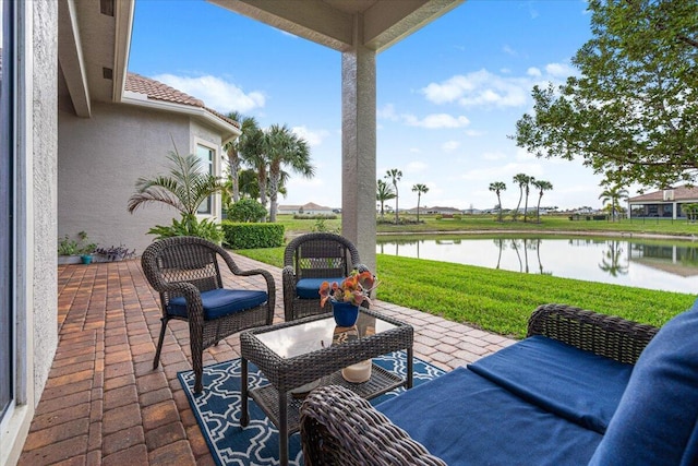 view of patio with a water view