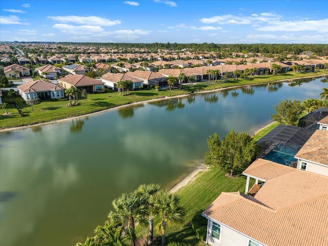 bird's eye view featuring a water view and a residential view