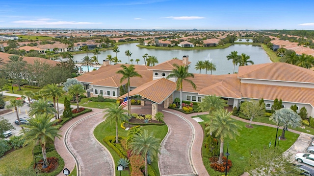 birds eye view of property featuring a residential view and a water view