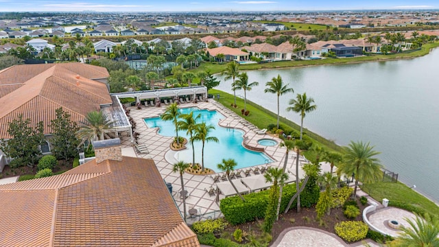 birds eye view of property featuring a residential view and a water view