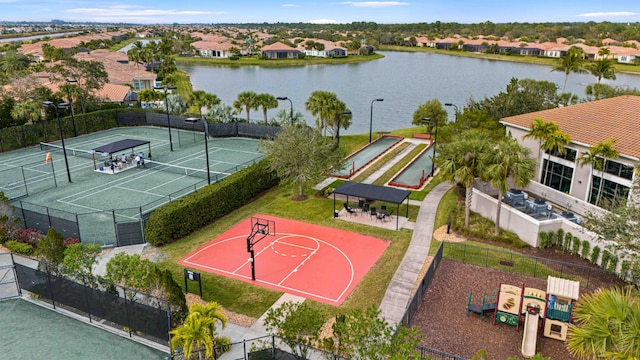 birds eye view of property featuring a water view and a residential view