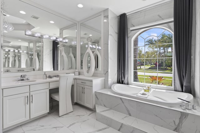 full bath featuring a garden tub, recessed lighting, visible vents, vanity, and marble finish floor