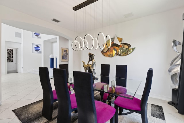 dining room with visible vents, baseboards, and light tile patterned floors