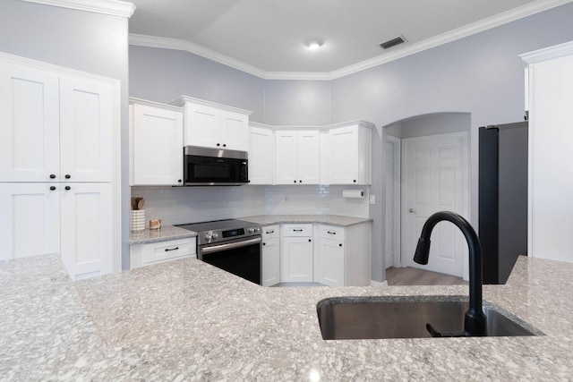 kitchen featuring electric stove, backsplash, ornamental molding, white cabinets, and a sink