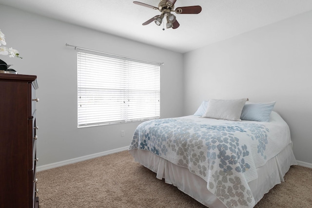 bedroom featuring carpet floors, ceiling fan, and baseboards