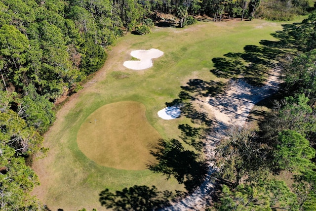 birds eye view of property with view of golf course