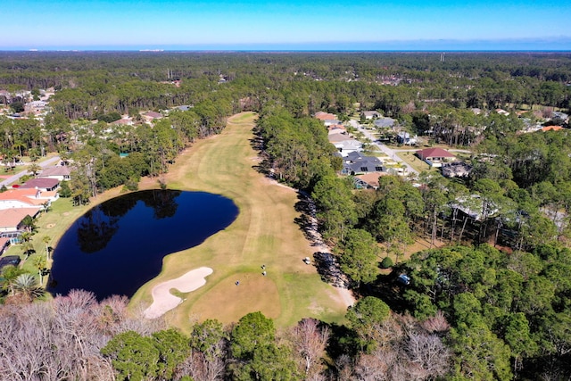 aerial view featuring a forest view, a water view, a residential view, and view of golf course