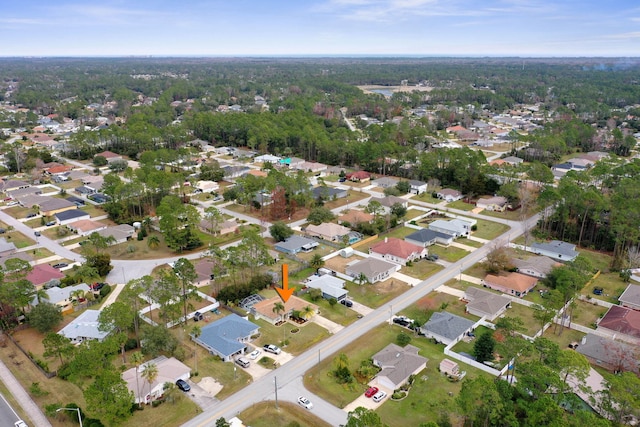 birds eye view of property with a residential view