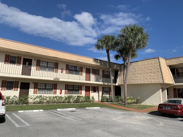 4683 Oak Terrace Dr, Greenacres, FL 33463 - view of building exterior featuring uncovered parking
