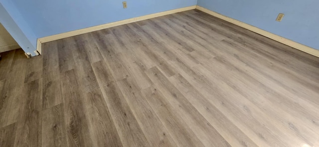 5724 SE Collins Ave, Stuart, FL 34997 - detailed view of wood finished floors and baseboards