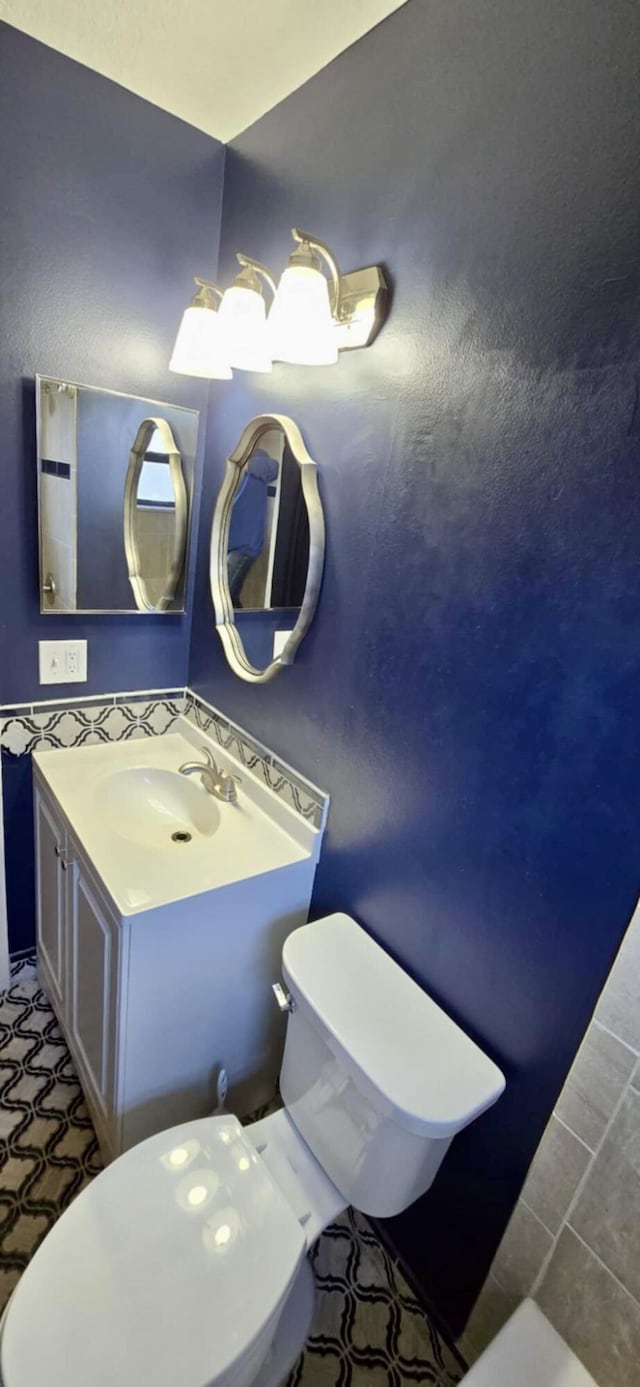 bathroom with vanity and toilet