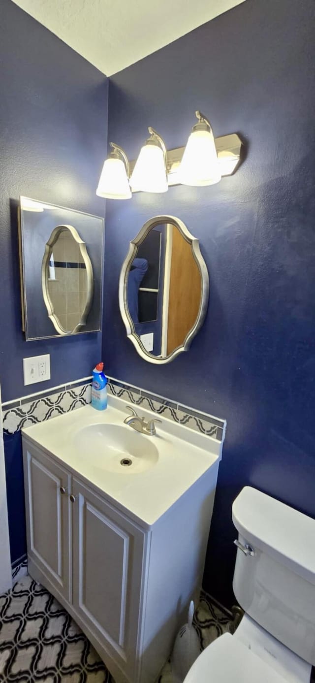 5724 SE Collins Ave, Stuart, FL 34997 - half bathroom with toilet and vanity