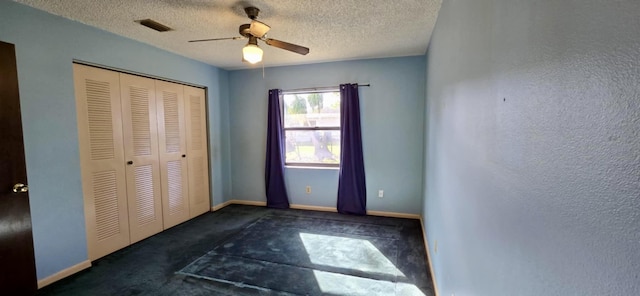 5724 SE Collins Ave, Stuart, FL 34997 - unfurnished bedroom featuring carpet flooring, a closet, baseboards, a ceiling fan, and a textured ceiling