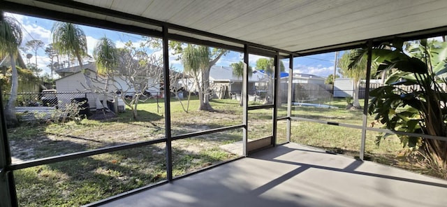 5724 SE Collins Ave, Stuart, FL 34997 - unfurnished sunroom featuring a residential view