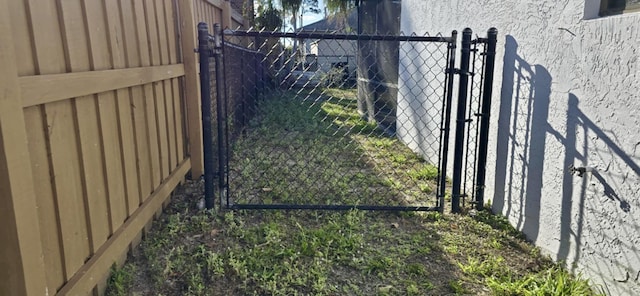 view of gate with fence