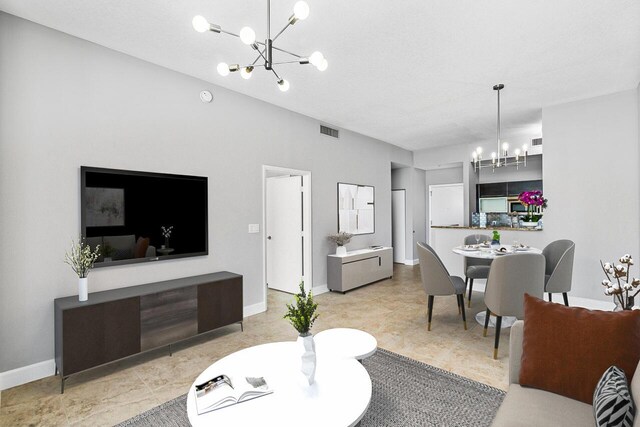 living room featuring a chandelier, visible vents, and baseboards