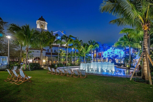 view of property's community featuring a yard