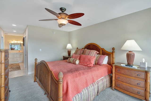 bedroom with ceiling fan, connected bathroom, recessed lighting, light colored carpet, and baseboards