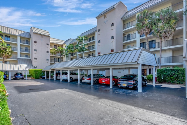 view of building exterior featuring covered parking