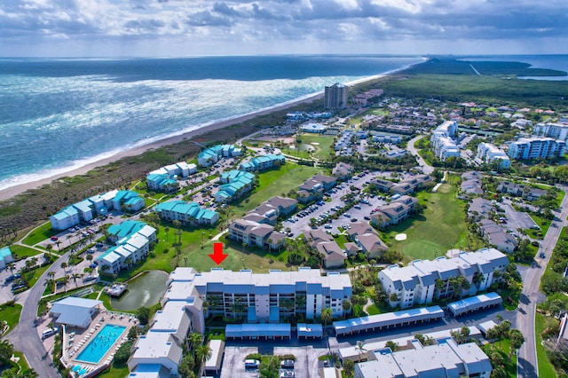 drone / aerial view featuring a view of the beach and a water view