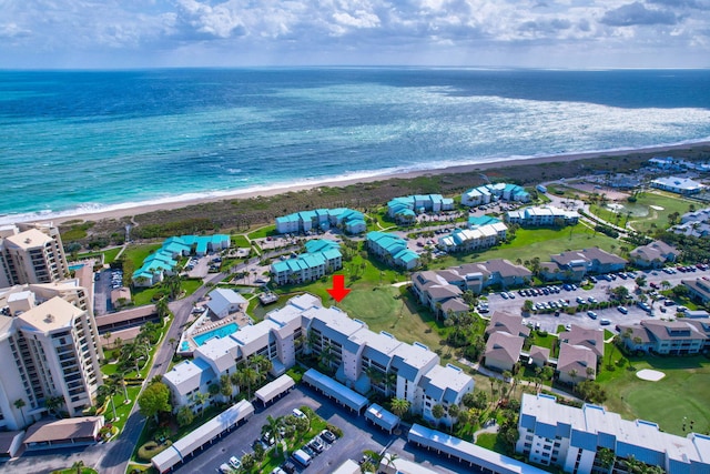 aerial view featuring a water view and a beach view