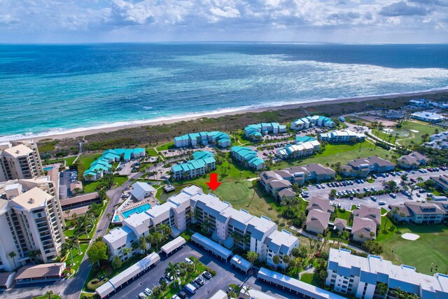 view of property's community with a yard and a water view